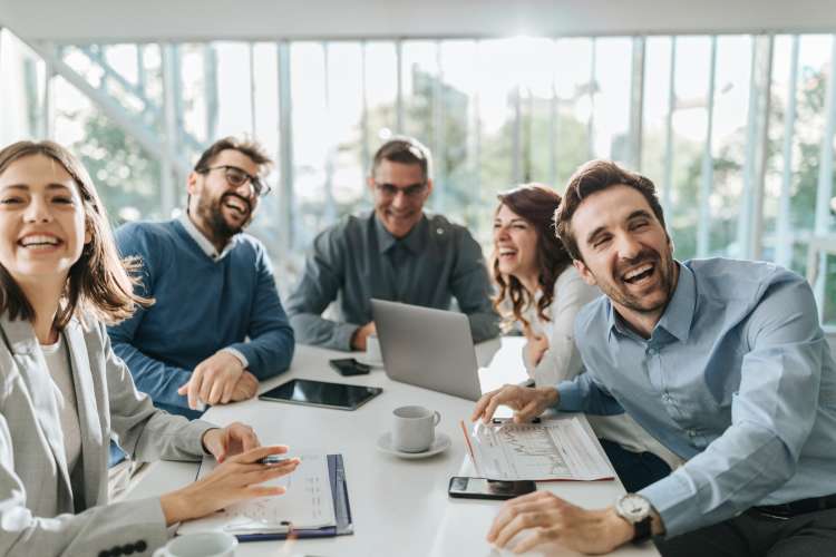 colleagues playing a game and laughing at work