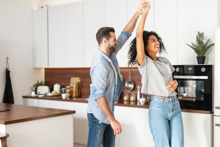 couple dancing in their kitchen