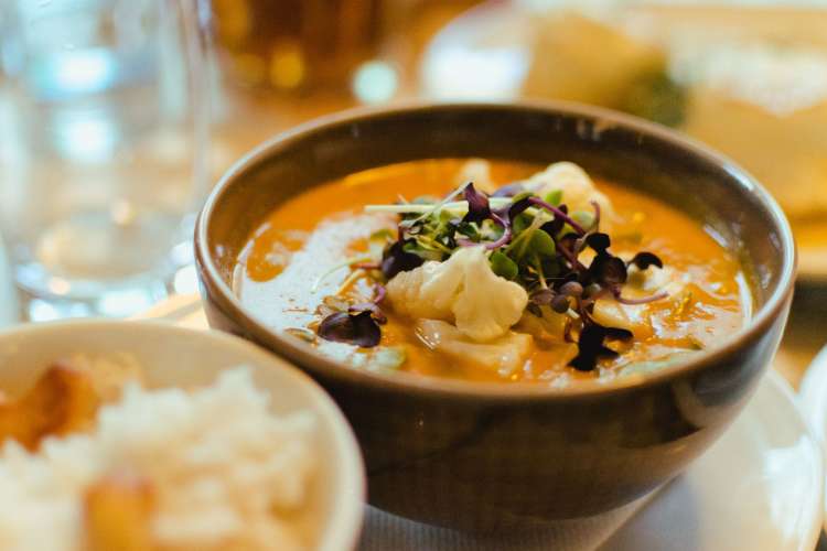 a bowl of curry on a table