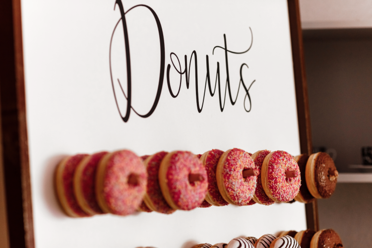 a donut wall is a cute engagement party idea