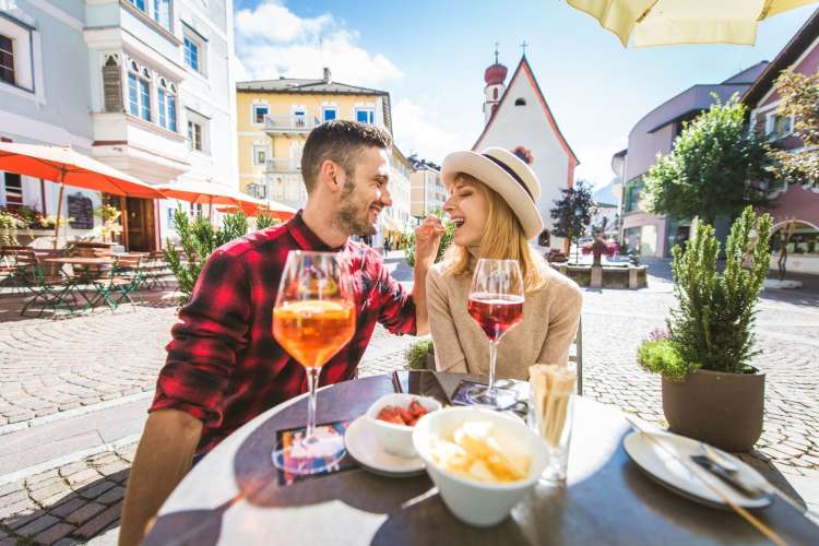 a couple eating at a new place for an alphabet date idea