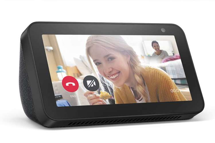 an amazon echo show with a friendly faced woman on the screen