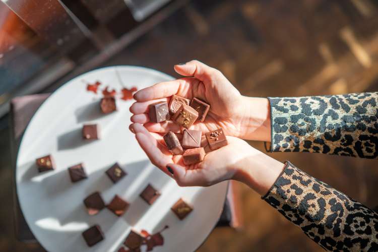 a handful of chocolates from an international snack box