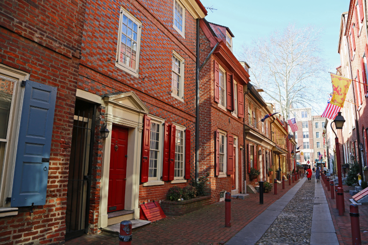 wide angle view of red brick homes in elfreth's alley, philadelphia