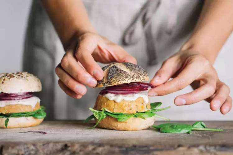 chef assembling a burger at brookfield place