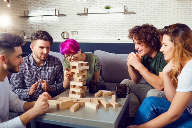 friends having a game night for a birthday party 