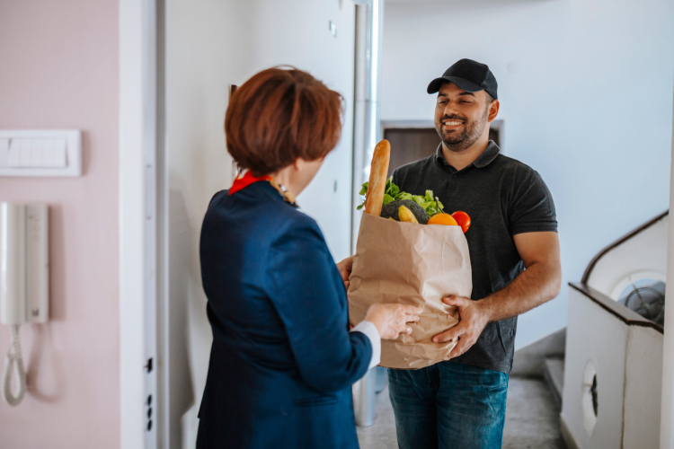 man delivery groceries to a home