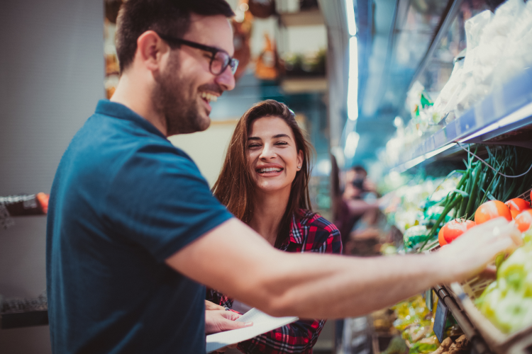 couple shopping with a grocery list