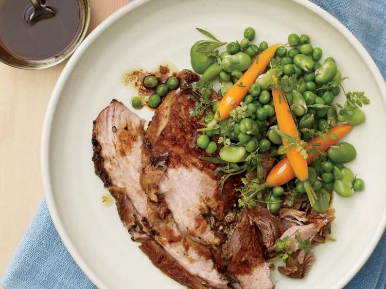 garlic rubbed pork shoulder with spring vegetables will brighten up your table