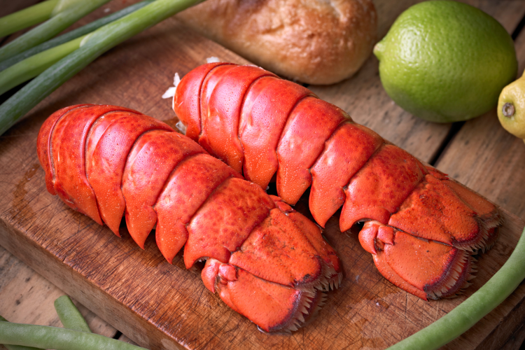 the first step in how to eat lobster tail is to remove the tail from the body