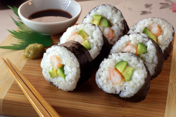 maki rolls on a bamboo board