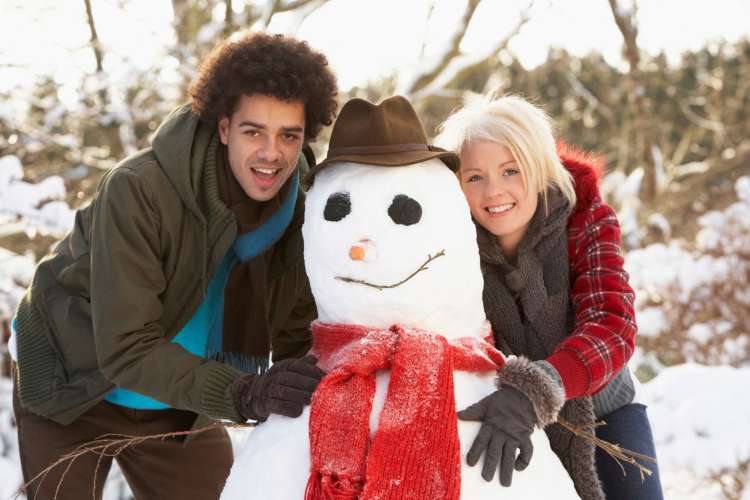 couple making a snowman