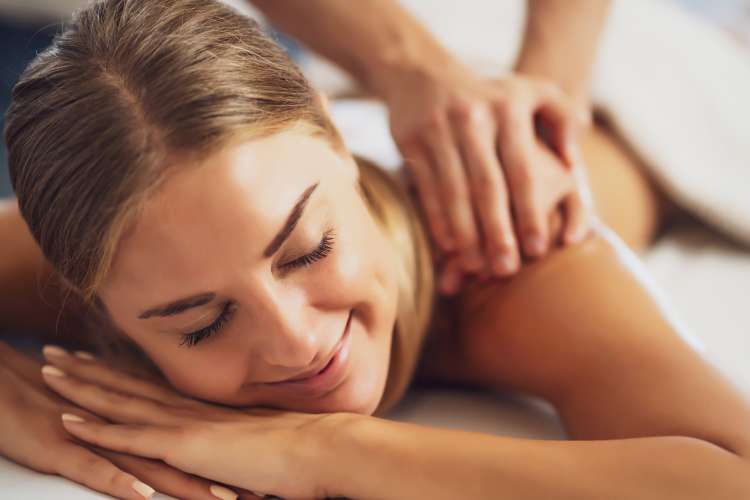 woman enjoying a home massage