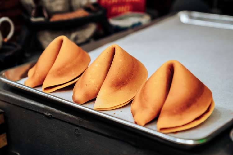 freshly made fortune cookies at the fortune cookie factory in san francisco