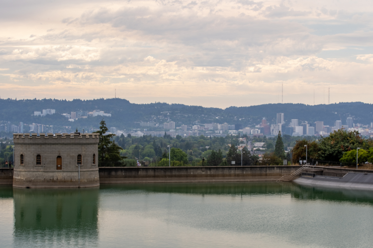 mt tabor park reservoir with a view of the portland skyline