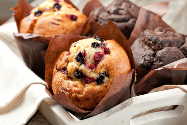 cranberry and chocolate muffins in a basket