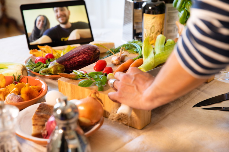 person cooking while taking an online cooking class 