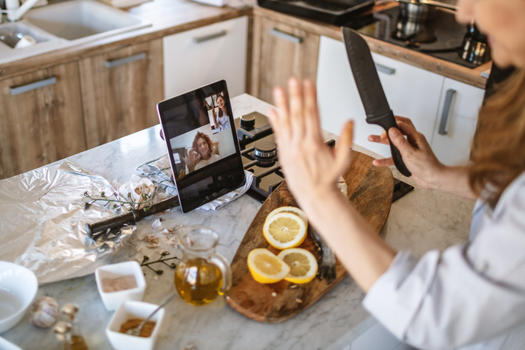 woman enjoying an online cooking class team building activity