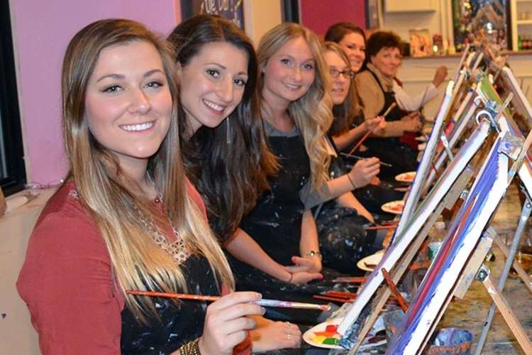 women attending a sip and paint bachelorette party