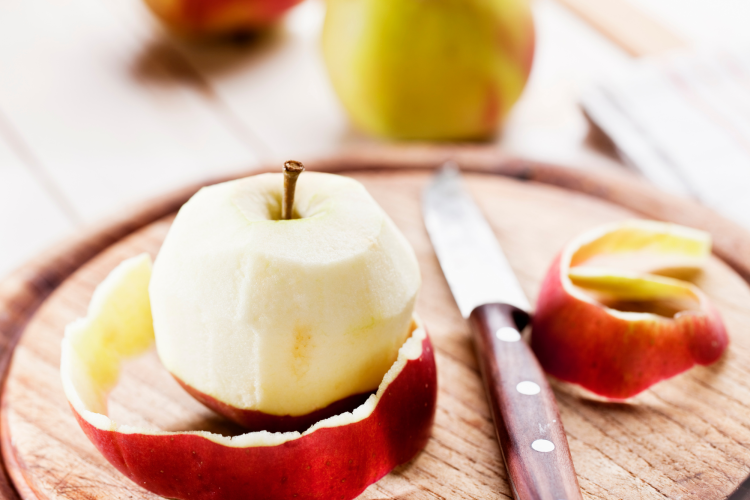 peeling an apple with a paring knife