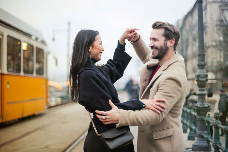 young couple ballroom dancing in the street