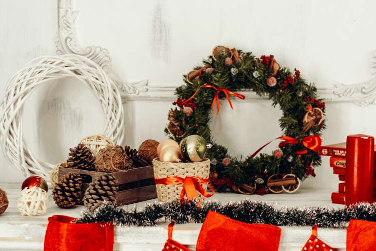 christmas wreath, ornaments and decor on a shelf