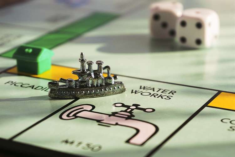 steamboat game piece on a monopoly board