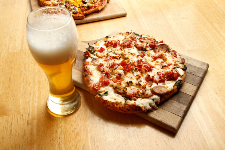 pizza and beer at a bar