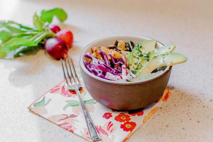 cabbage and slaw plated in a bowl