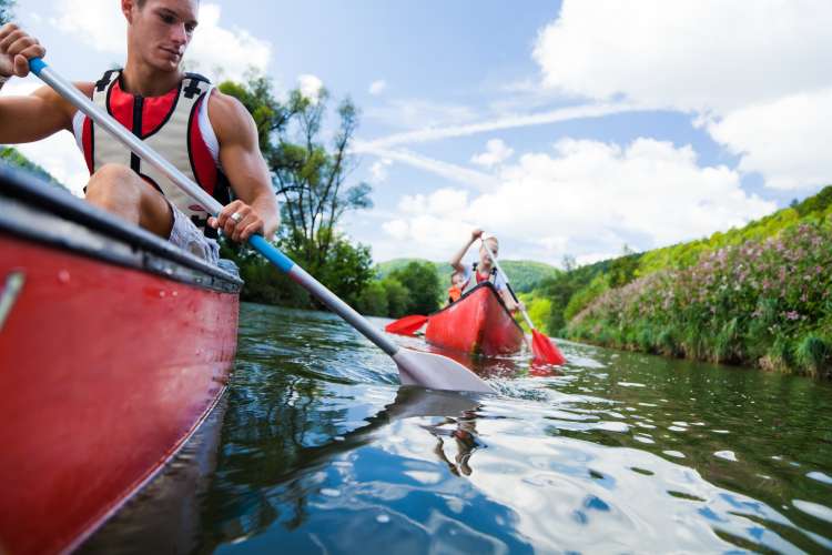 couple going for a kayak trip on the river