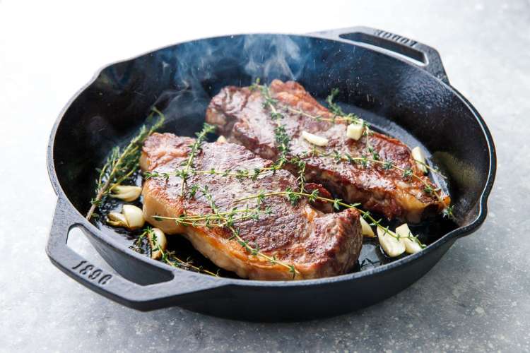 reverse sear steak with garlic and thyme achieves tender, juicy steaks