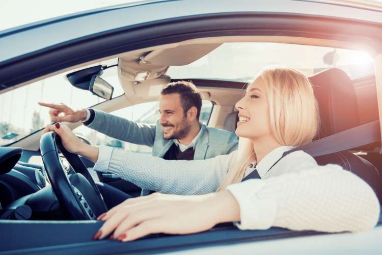 couple enjoying a car ride together