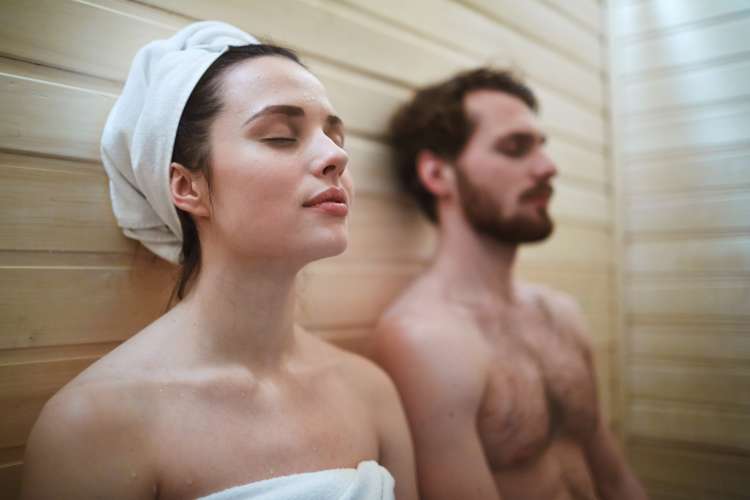 couple enjoying a sauna