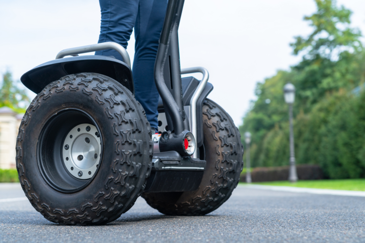 person standing on a segway vehicle