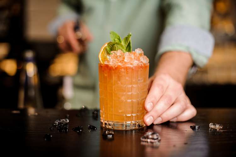 bartender mixing a craft cocktail