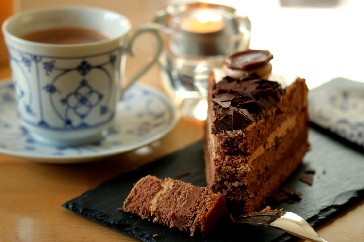 slice of chocolate cake with tea