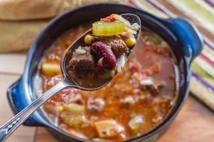 spoonful of a bean and beef chili cooked in a slow cooker