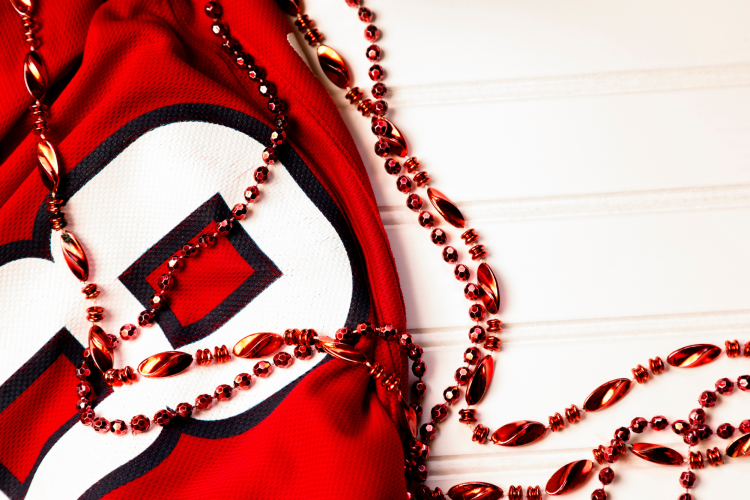 a red sports jersey with red beads