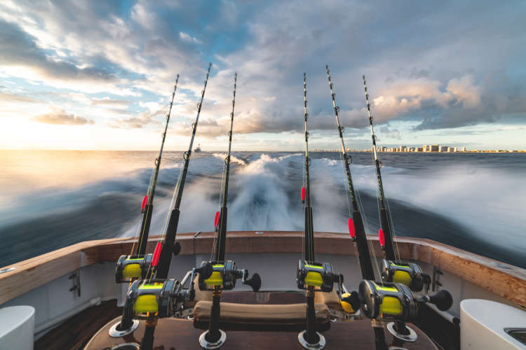 charter a fishing boat as a gift for him