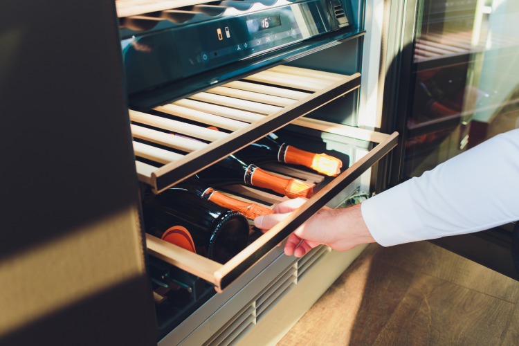 wine stored horizontally in a wine fridge