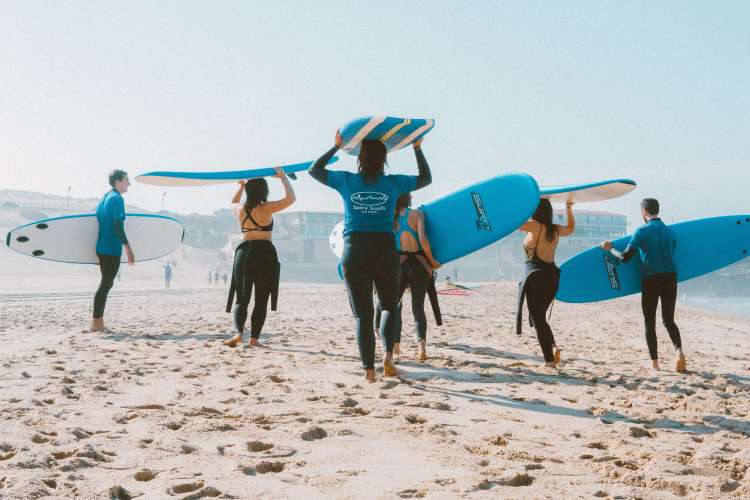 go surfing for a fun team building activity in San Diego