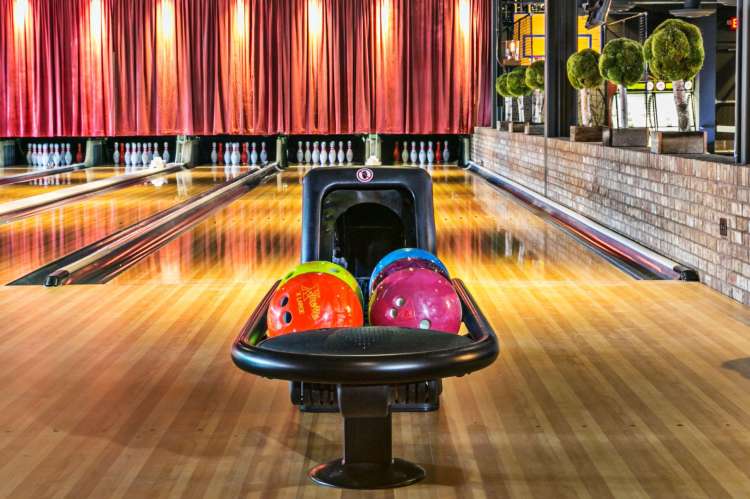 bowling alley and colorful bowling balls at the painted pin