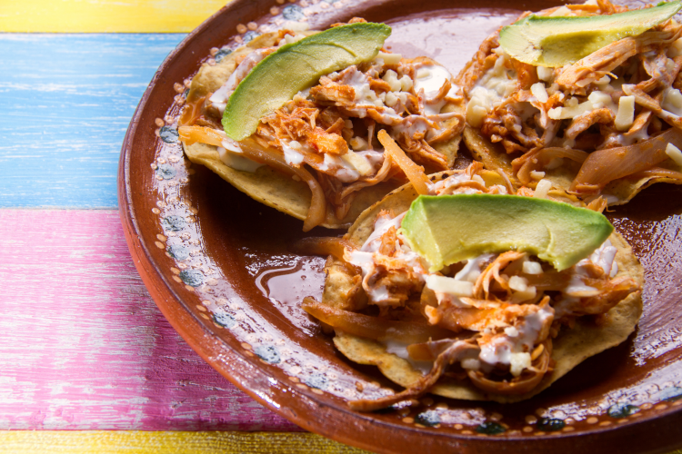 tostadas with meat, avocado and cheese