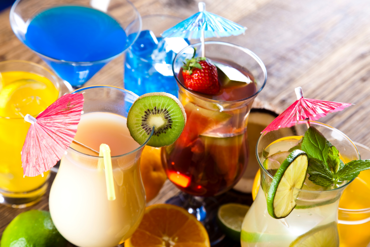tropical colorful drinks with mini umbrellas