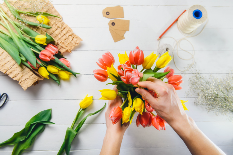 arranging tulips in a vase