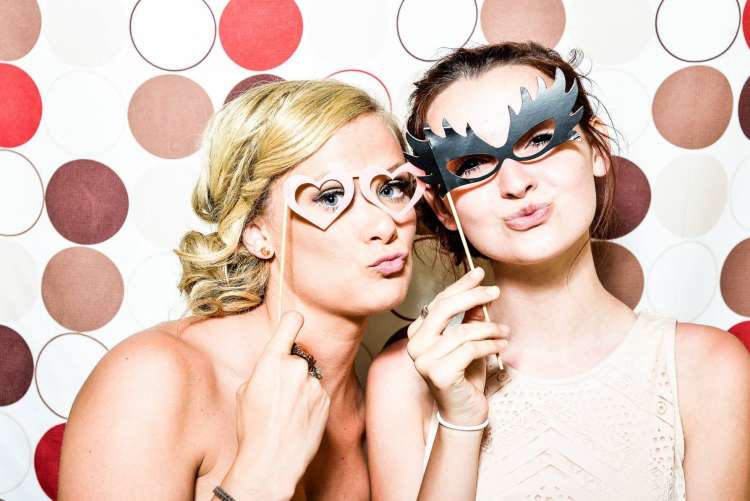 a photo booth party is a work christmas party idea that is actually fun