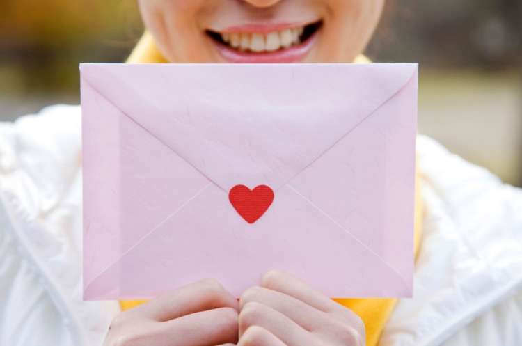 woman holding a valentine card