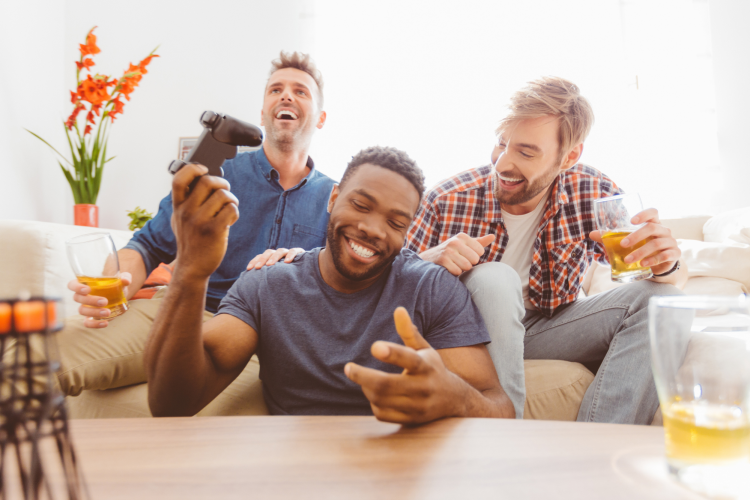 young men having fun playing video games