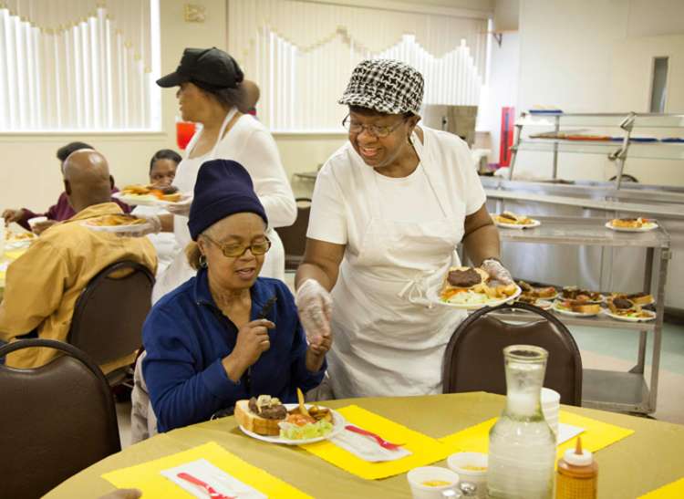 People volunteering at a soup kitchen