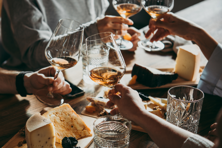 friends toasting at a wine bar